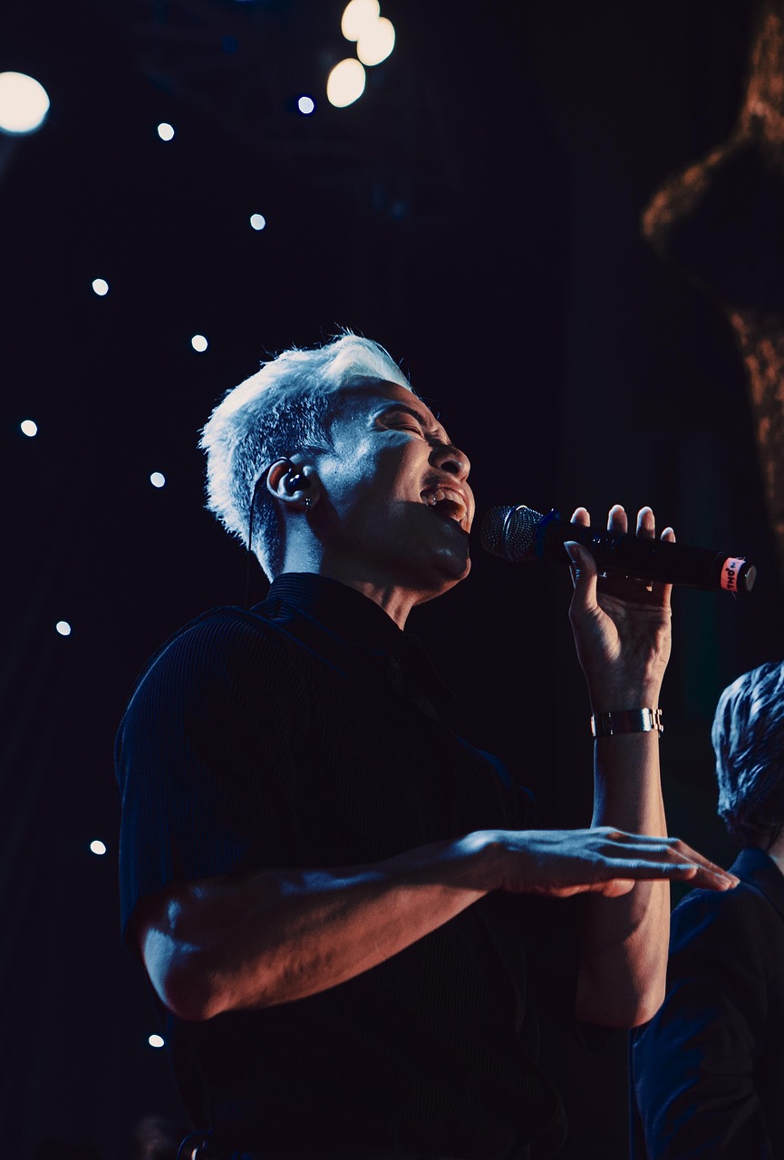 gospel singer female microphone purple light