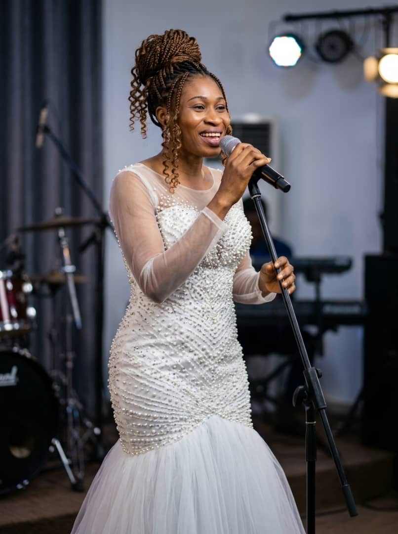 gospel singer female microphone purple light